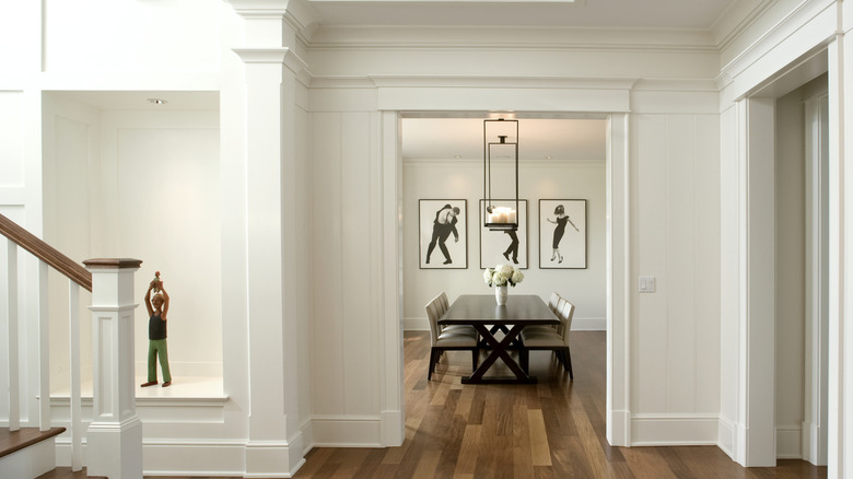 Hallway and doorways with decorative baseboards and moldings