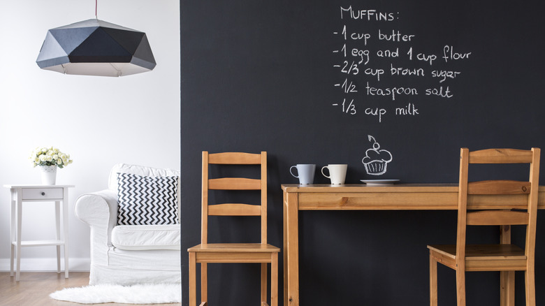 A chalkboard wall behind a table