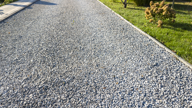 A gray granite driveway in the sun.