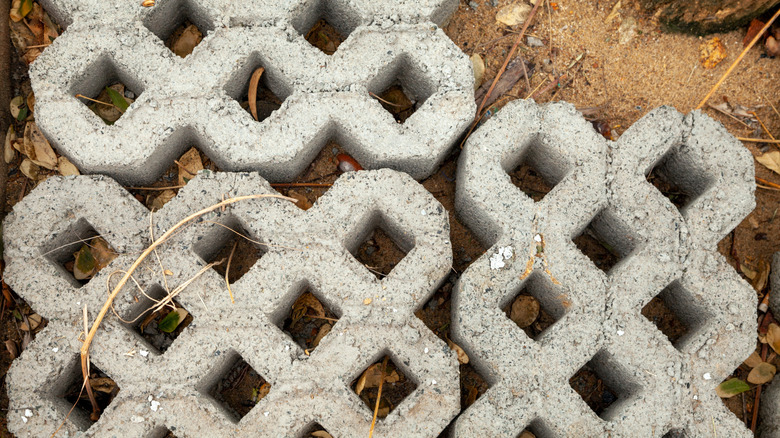 Loose turfstone pavers sitting on dirt.