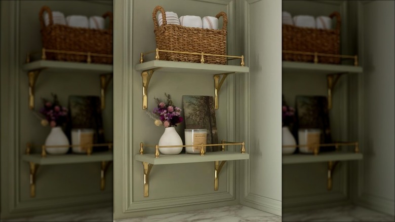 Green bathroom shelves with gallery rails