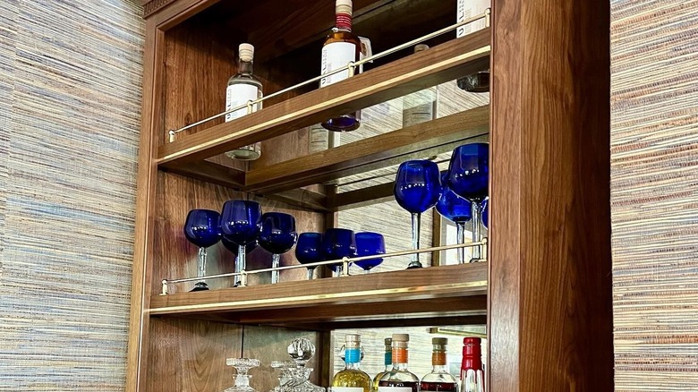 Stocked bar shelves with gallery rail
