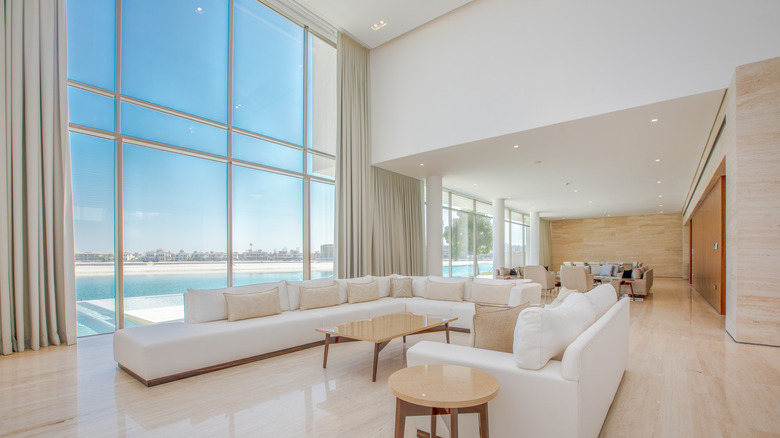 white room with floor-to-ceiling windows 