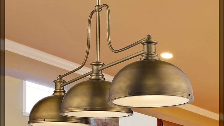 Brass three-arm light fixture