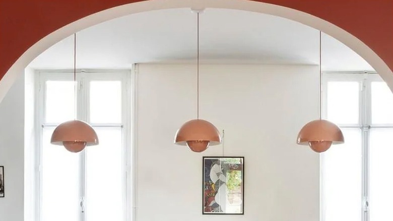 Flowerpot pendant lights hanging in a kitchen