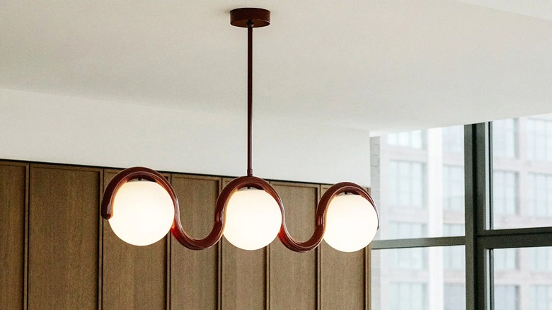 Linear light fixture with three globe lights