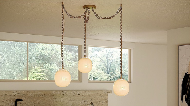 Swag light fixture with three globes