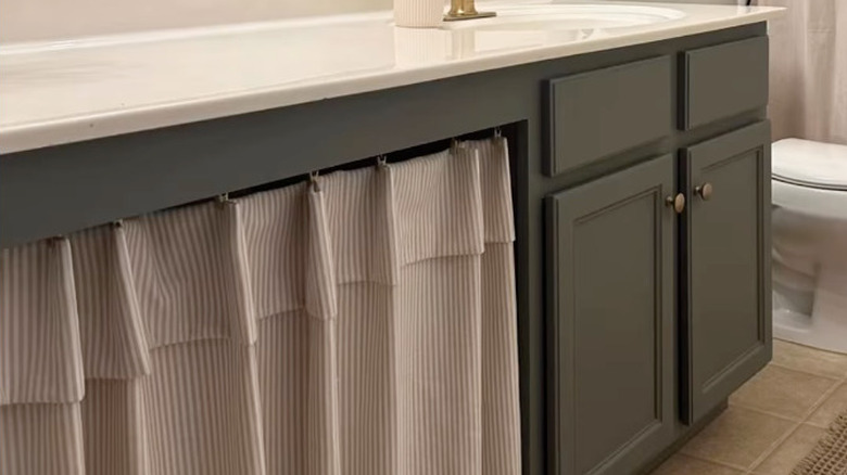 curtain over bathroom trash nook