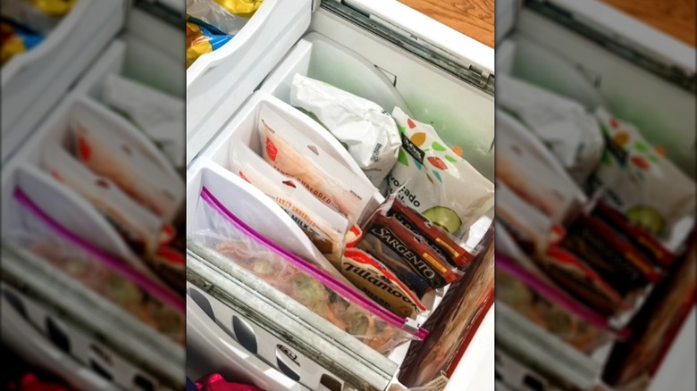 Book bins in freezer with frozen food inside