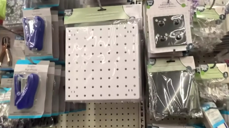 White pegboards on an aisle in Dollar Tree