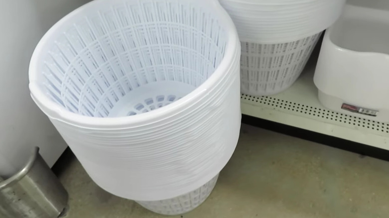 Stack of white Dollar Tree laundry baskets
