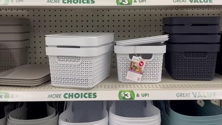 Stackable bins with a lids on a Dollar Tree shelf