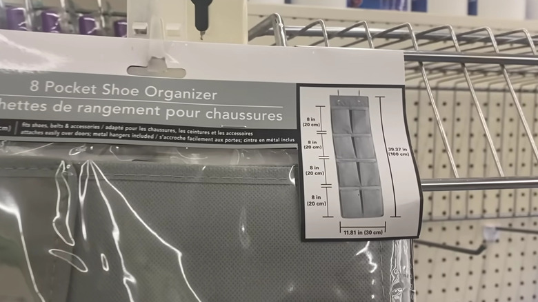 Two hanging storage pouches, one black and one white