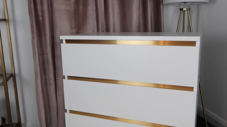 white IKEA dresser gold accent