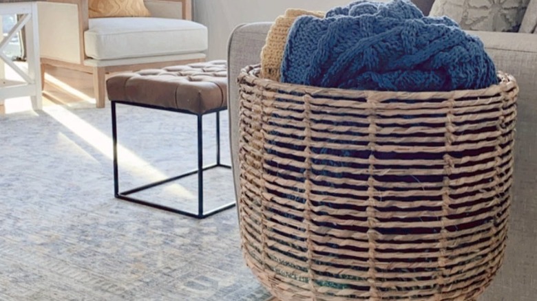 A large planter being used to store blankets