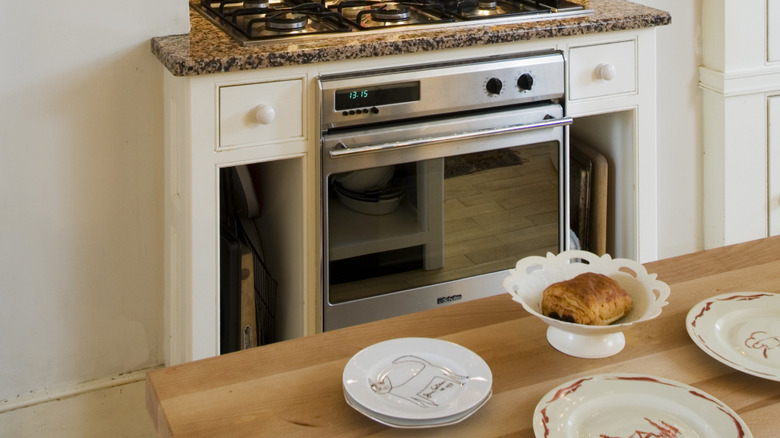 Decorative plates in kitchen on a wooden counter top