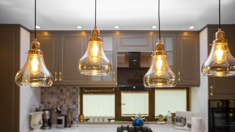 Four pendant light fixtures in the kitchen