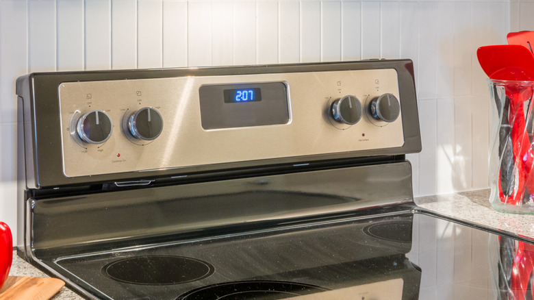 Clean black stove with a silver backguard