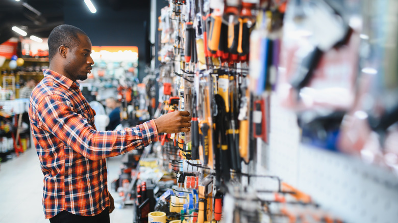 Man shopping for tools at a hardware store