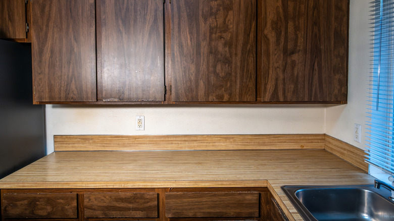 Dark laminate cabinetry in kitchen