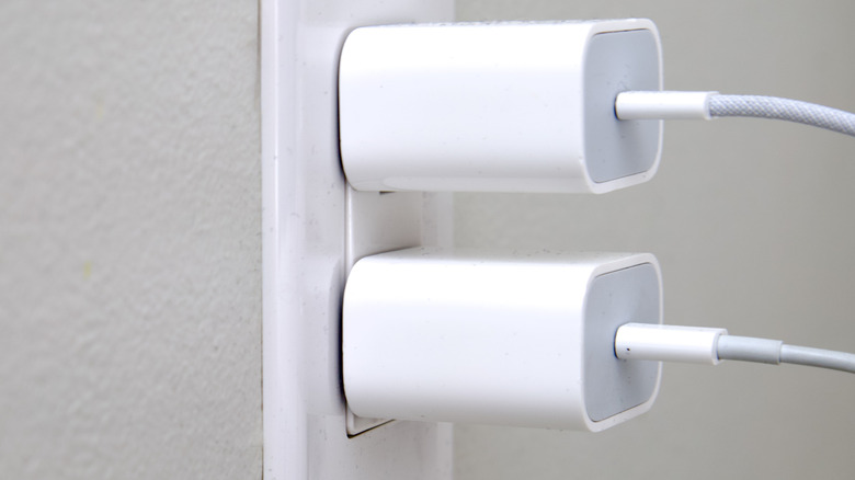 Two chargers plugged into an electrical receptacle
