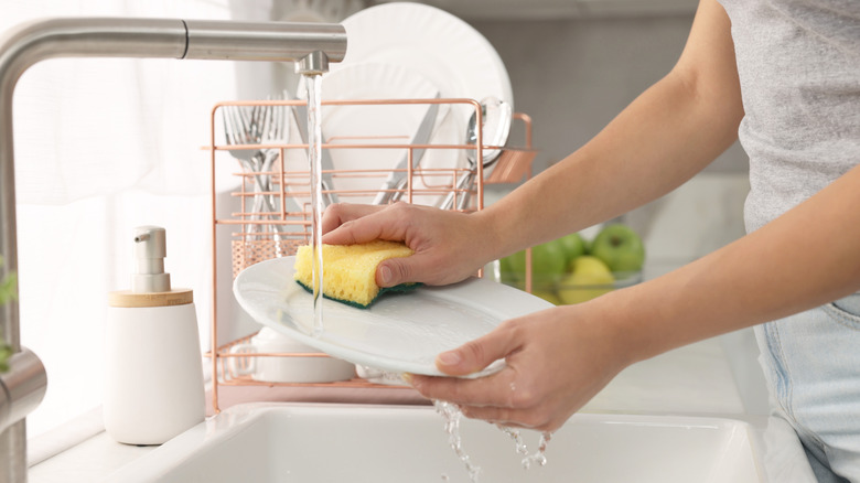 Woman washing dishes