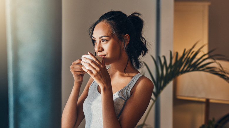 Woman enjoying coffee in morning