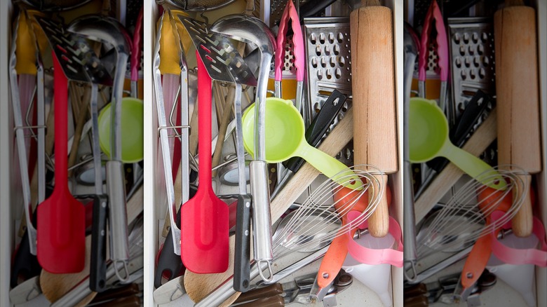 A cluttered drawer in the kitchen