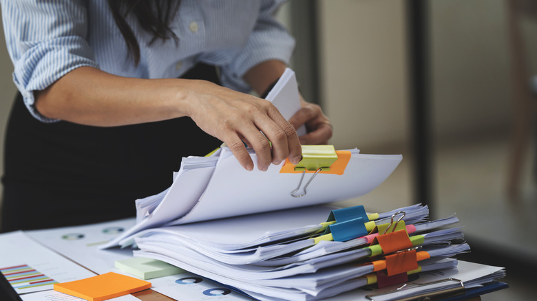 A woman going through paperwork