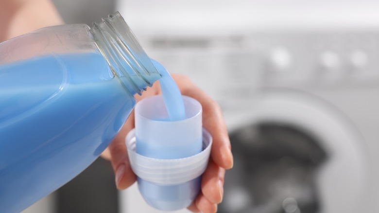 Liquid fabric softener being poured into cup