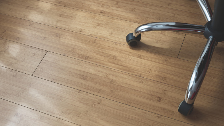 office chair feet on bamboo floor