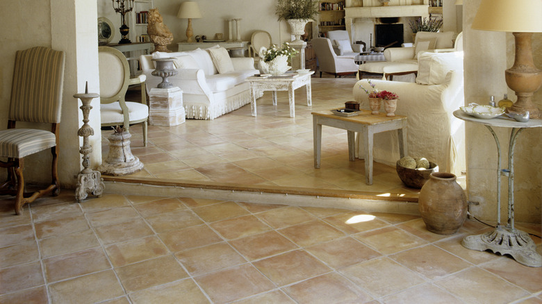 travertine stone tiles in 19th century home with vintage furniture and decor