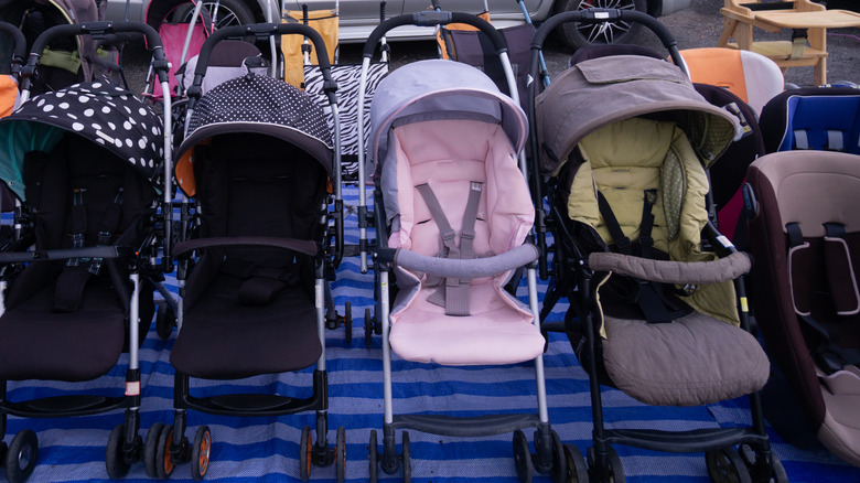A row of second hand strollers