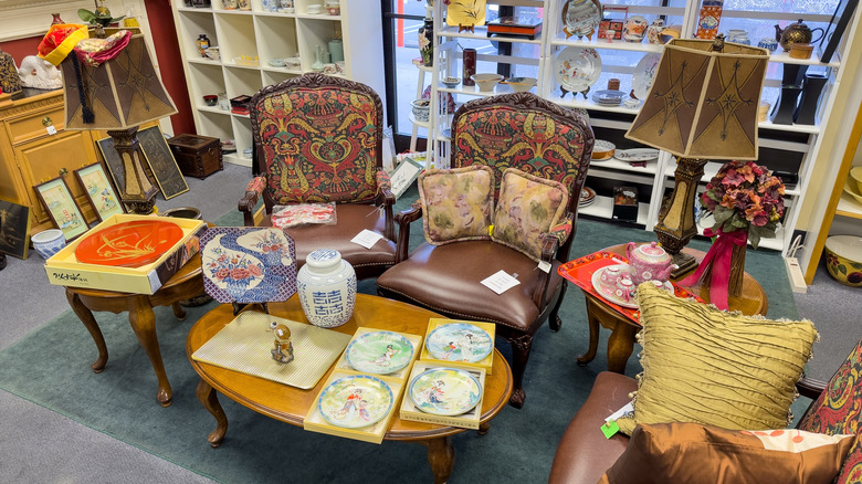 Vintage furniture set and ceramics at thrift store