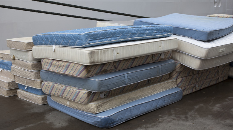 pile of used mattresses