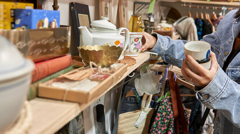 Woman shopping for decor in thrift store