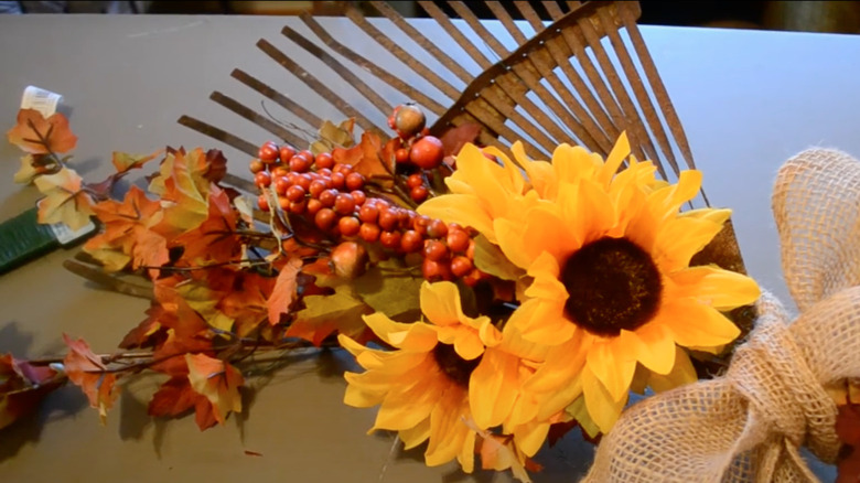 Rake decorated with autumn foliage