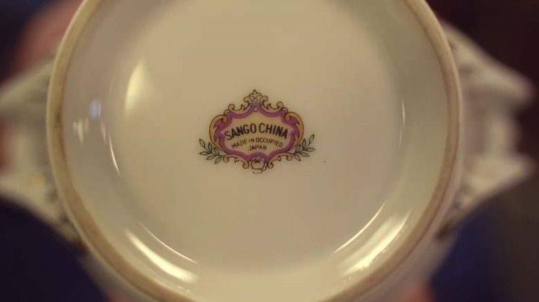 Closeup of a vintage plate to show its mark of "Sango China - Made in Occupied Japan"