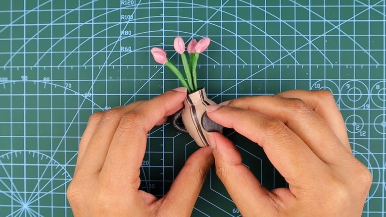 Attaching magnet to a small clay vase
