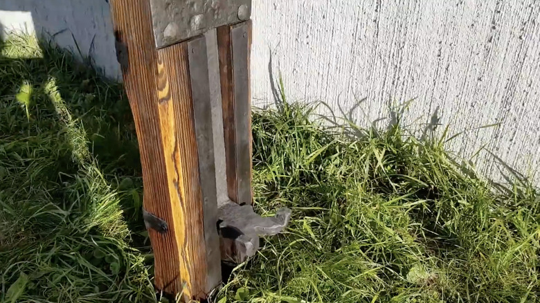 An antique wagon jack showing the lever to raise a wagon