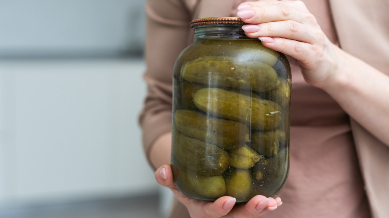 A jar of pickles in pickle juice