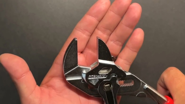 A person is shown holding an Icon 10 inch pliers wrench