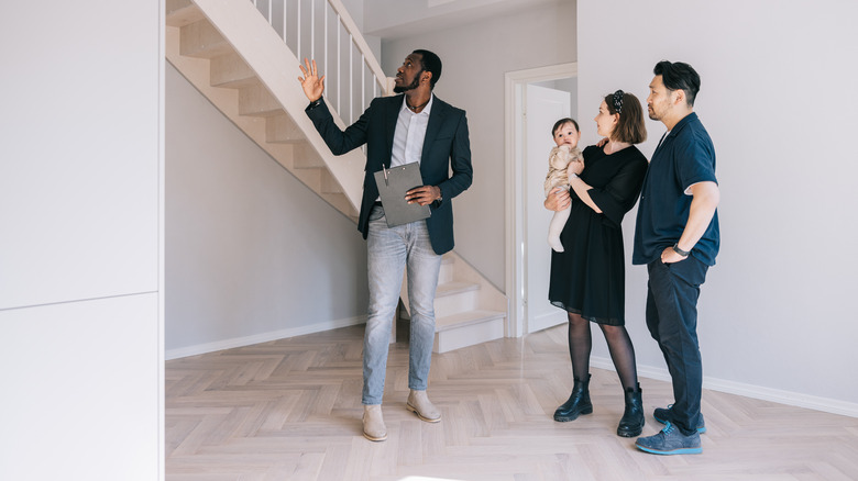 buyers looking at house with realtor