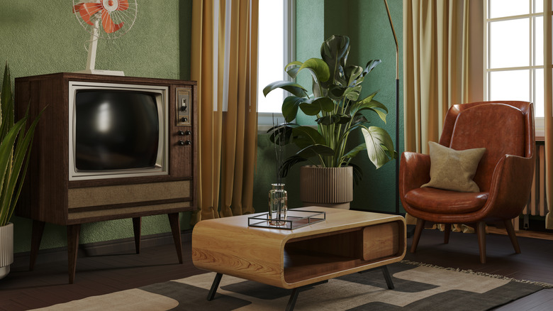 Mid-Century Modern living room with tv, chair, table