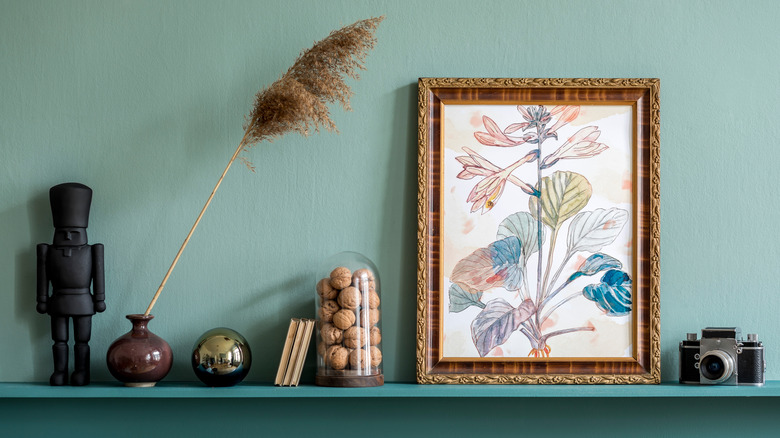 Framed art in a vintage frame and other decor
