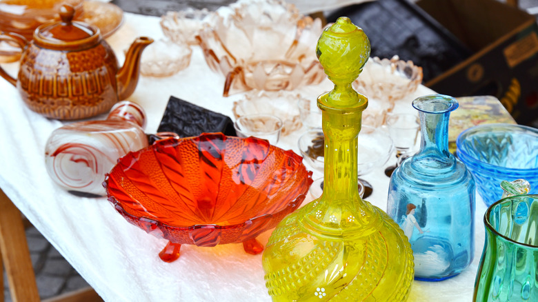 A collection of colored glassware on a table