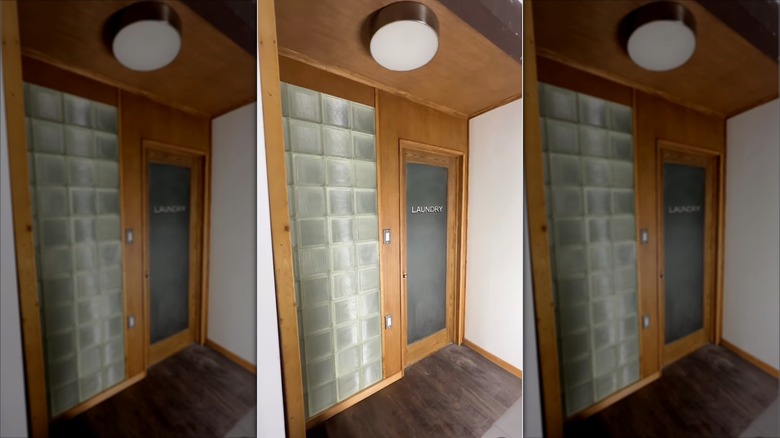 Laundry room accent wall made of glass blocks.