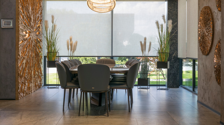 Solar shades in the windows of a lovely dining room
