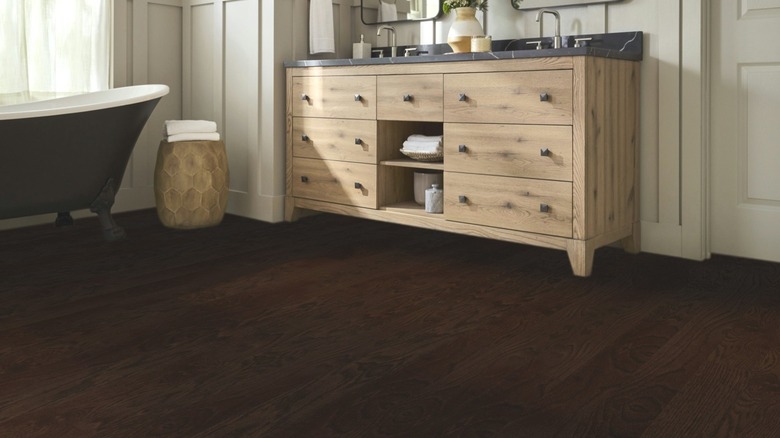 Dark brown hardwood floors in a bathroom