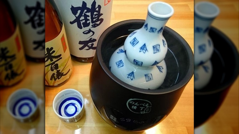 Nonbei Yokocho Electric Sake Warmer with sake in it